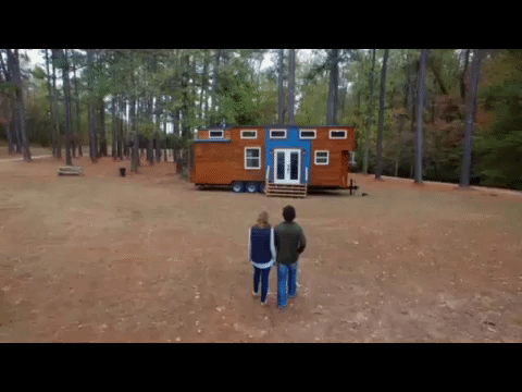 couple walking towards their tiny house