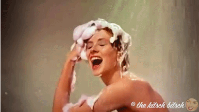 Woman in Shower Shampooing Hair GIF
