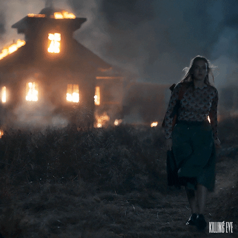 Villanelle stomping away from a burning house in season 3