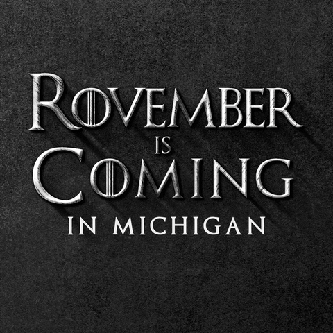 Text gif. In gray Game of Thrones font against a stony black background reads the message, “Rovember is Coming in Michigan.”