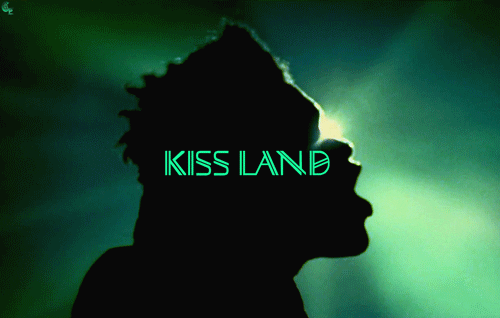 7. "Kiss Land" tattoo with a neon sign design - wide 1