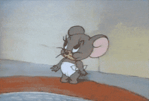 Cartoon gif. Nibbles the baby mouse from Tom and Jerry opens his mouth wide and points into it.