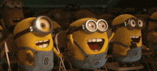 Cartoon gif. The Minions are sitting together in an audience and they are going wild with excitement. They all cheer in their seats, standing on the chairs, jumping, and clapping their hands with glee.