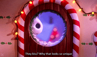 Movie gif. Jack Skellington from The Nightmare Before Christmas peaks through a window with Christmas decorations around it. Text, "They kiss? Why that looks so unique."