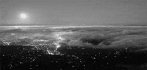 partly cloudy city GIF
