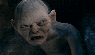Movie gif. Gollum from "Lord of the Rings" appears devilish and furious, then opens his mouth wide to scream.