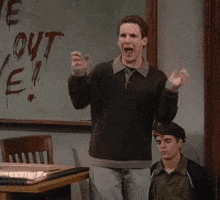TV gif. Ben Savage as Cory in Boy Meets World screams in terror holding his hands up and shaking then running away.