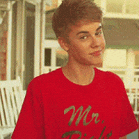 justin bieber shrug GIF