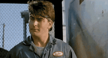 Movie gif. Charlie Sheen as Carlos and Emilio Estevez as James in Men at Work look at one another and say, "Golf clap? Golf clap," before the two of them gently clap their hands together. The words "Gold clap" appear on the screen in all caps.
