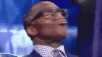 TV gif. American sports analyst and former Denver Broncos tight end tilts his head back, purses his lips outward, and closes his eyes as he adamantly shakes his head in disapproval. 