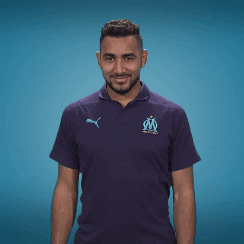 Sports gif. Dimitri Payet of Ligue 1 club Marseille looks at us and smiles before giving us the OK hand symbol. Emojis of the OK symbol pop up all around him and the text at the bottom also reads, "OK!"