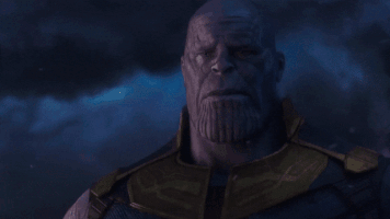 Movie gif. Josh Brolin as Thanos from the Avengers: Infinity War. He looks at us with tears in his eyes and rain whistling around him and says, "I'm sorry little one..."