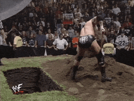 Giphy - digging triple h GIF by WWE