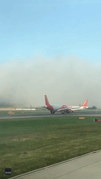 'Out of Nowhere': Plane Bursts Through Low Cloud in Dramatic Gatwick Landing
