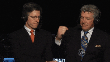 Sports gif. Two Boston Bruins hockey announcers bump fists and then point at us as they smile.
