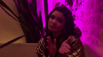Celebrity gif. Tess claps her hands sarcastically while nodding her head.