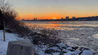Ice Flows on Hudson River Against Backdrop of Stunning Sunset in New York City