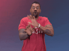 Celebrity gif. Donning a red Old Spice t-shirt, comedian Deon Cole shakes his hands and head wildly while frantically saying, "no, no, no" with wide eyes.