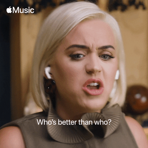 Celebrity gif. Katy Perry is singing and twists her face into a mean expression as she sings the lyrics, "Who's better than who?"
