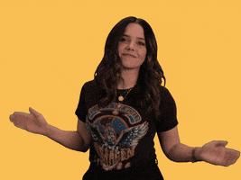 Celebrity gif. Sophie Bush exaggerates a clap, punctuated by animated dark yellow lines, nodding against a yellow background.