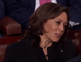 Political gif. Kamala Harris sitting in a chair at the State of Union, looking incredibly annoyed and incredulous. She's obviously displeased, as she purses her lips and shakes her head, not agreeing with what she's hearing.
