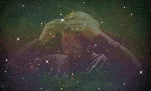 A man moving his hands away from his forehead sideways, in a mind-explosion gesture. An overlaid animation enforces the explosion character