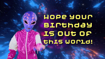 Video gif. Purple alien wearing a pink tracksuit throws confetti at us and blows a party horn, in front of a trippy galactic animation. Text, "Hope your birthday is out of this world!"