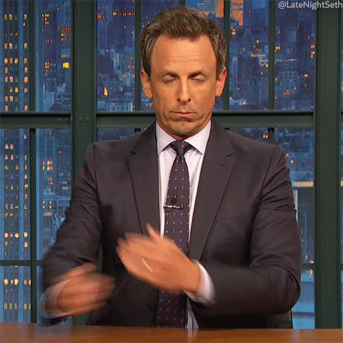 TV gif. Seth Meyers as host of Late Night looks at us with a straight face as he crosses his arms over his chest like a corpse and leans back. 