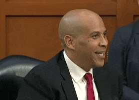 Cory Booker Shoulder Brush GIF by GIPHY News