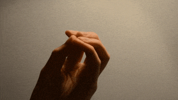 Video gif. Hand with fingers closed to a point expands to reveal a digitally animated translucent geometric webbing connecting the fingers, which waggle and then close again.