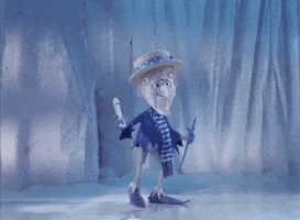 Cartoon gif. In a scene from The Year Without a Santa Claus, the Snow Miser tosses some snow into the air. As it falls around him, he does a pirouette on the ice.