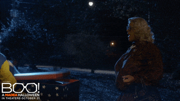 Movie gif. Tyler Perry as Madea. They're out during Halloween and Madea watches a clown pop out of a box in an attempt to scare her. She straight up decks him and they go flying. Text, "You got knocked the hell out!"