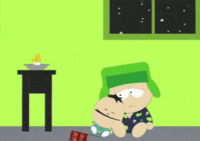 South Park gif. Tired and confused, Kyle cuddles and falls asleep next to his baby brother Ike as a dying candle fades, and snow falls outside the window.