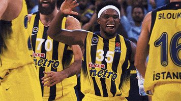 Sports gif. Bobby Dixon from Fenerbahçe, a Euroleague basketball team, high fives and chest bumps with teammate Kostas Sloukas.