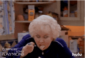 TV gif. Doris Roberts as Marie Barone on Everybody Loves Raymond holds a bowl full of what looks like mash potatoes. She leans down and tastes a forkful of it. She closes her eyes and puts a hand on her chest as if this is the best dish she’s ever tasted. 