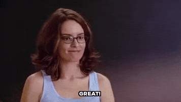 Movie gif. Tina Fey as Ms. Norbury in Mean Girls Stands in front of a blackboard. She gestures with her fists as if to say, "All right!" Text: Great!
