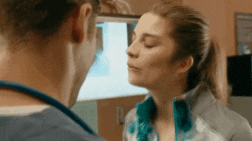 Schitt's Creek gif. Alexis nods in agreement, bopping her head emphatically, as she searches for her next words.