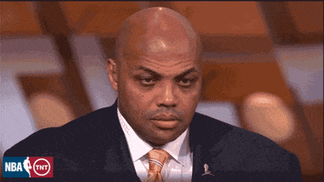 Sports gif. Charles Barkley, wearing a suit on air, slowly closes his eyes, succumbing to sleep on the job. Wake up, Charles!