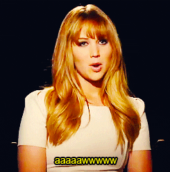 Celebrity gif. Jennifer Lawrence is being interviewed and she slowly says, "Awwwww."