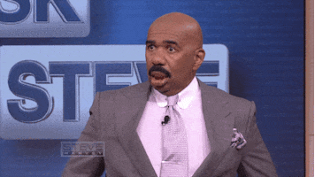 TV gif. Steve Harvey on Steve Harvey TV. He looks shocked but then points at his mouth and waves his hands over his face and his normal grinning face is back in place.