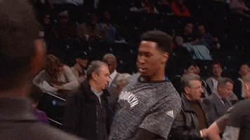 Sports gif. Rondae Hollis-Jefferson of the Brooklyn Nets does a celebratory dance on the court, hitting each move perfectly.