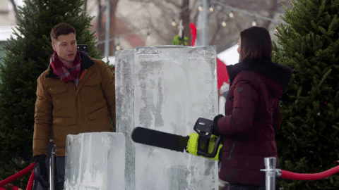 Chainsawing a big ice block at Christmas