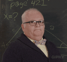 Awkward Teacher in class teaching for an exam.