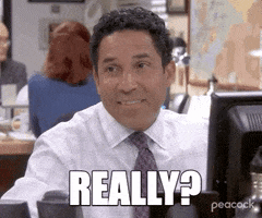 The Office gif. Oscar Nuñez as Oscar Martinez cocks his head to the side with a blank facial expression. Text, "Really?"