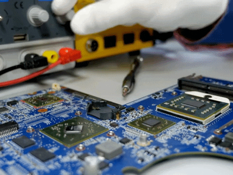 Engineer repairing laptop and printer showing professional repair service in Thane