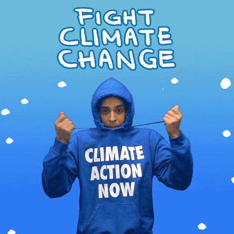 Digital art gif. Cartoon snowflakes fall around and pile up on the head of a man wearing a blue "climate action now" sweatshirt as he pulls the strings of his hood so that the hood closes tightly around his face. He's shivering. Text above the man reads, "Fight climate change," all against a frosty blue background.