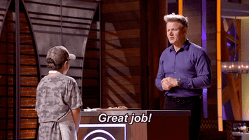 Reality TV gif. In the MasterChef Junior kitchen, a proud Gordon Ramsay high-fives a young contestant wearing a gray camo shirt and a baseball cap. Text, "Great job!"