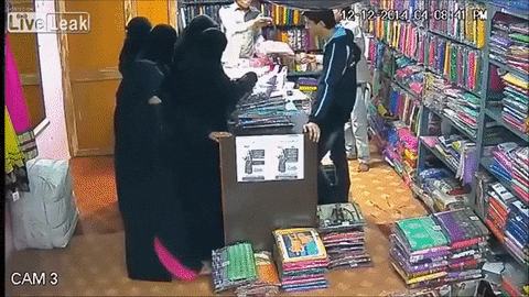 gang wearing burqa shoplifting GIF