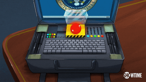 Gif of a cartoon suitcase containing a keyboard, coloured lights, an official looking screen and a big red button. 