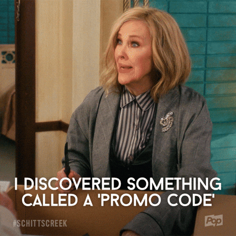 a woman is sitting at a table and saying `` i discovered something called a promo code '' .